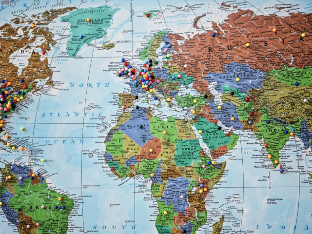 How Cultural Differences Shape Your Happiness 'a map of the world with a pin point'